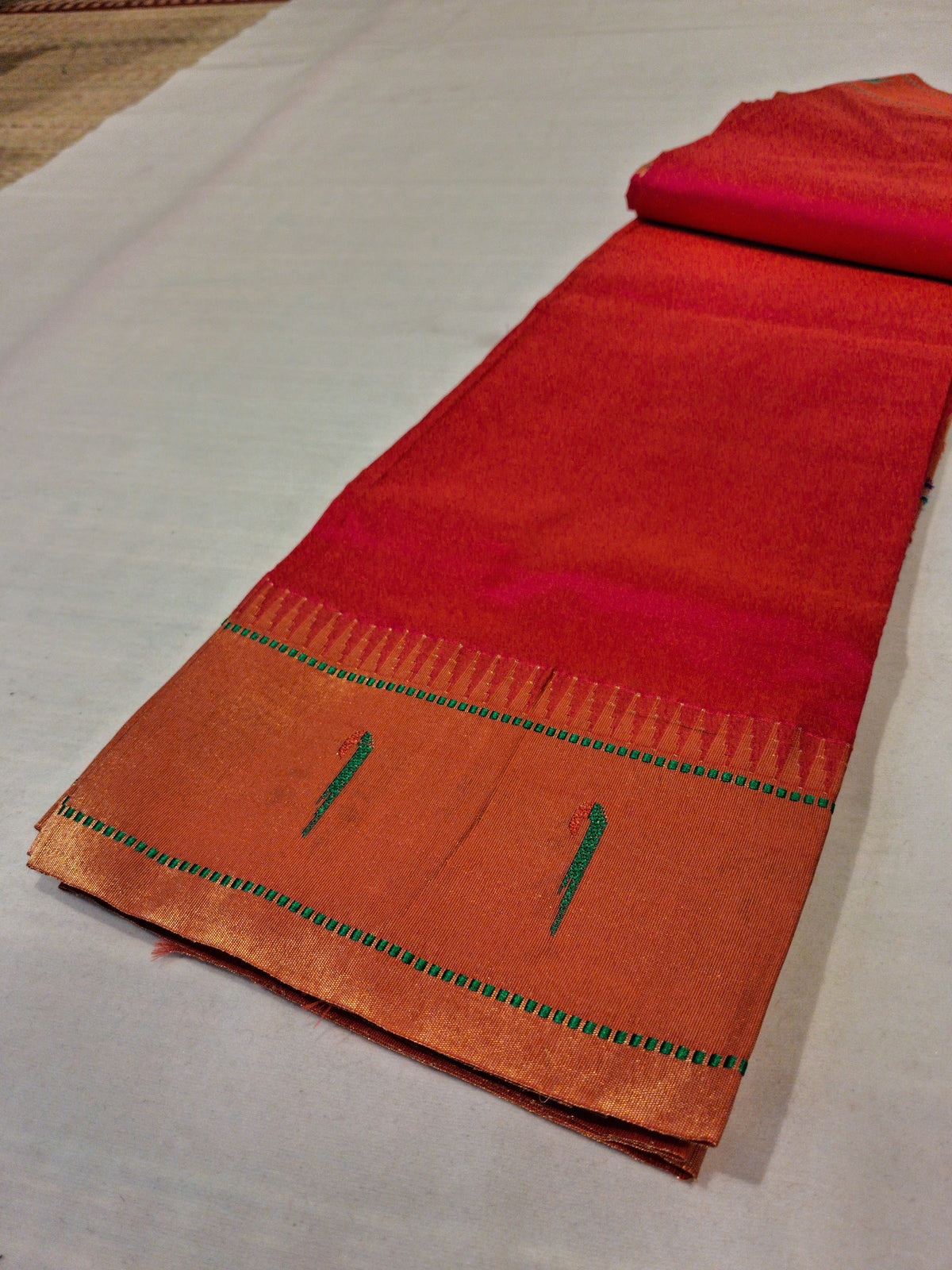 Vermilion red Muniya Paithani silk saree with parrot border